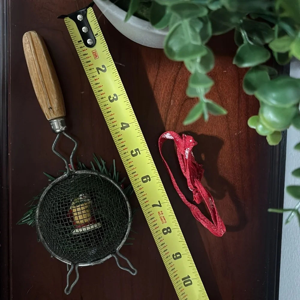 Handmade Santa Holiday Wreath on an old tea strainer.